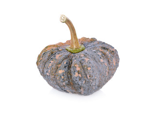 whole raw pumpkin with stem on white background