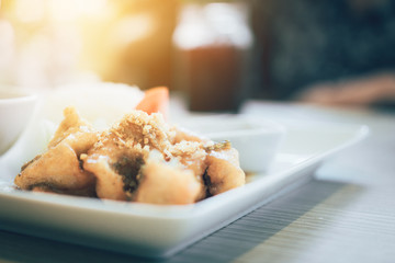 Hot fish fried on dish at restaurant.