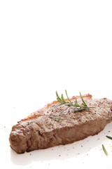 Grilled Beef Steak with pepper and rosemary isolated in white background