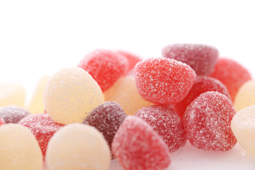 Colorful jelly sugar candies close up isolated in white background