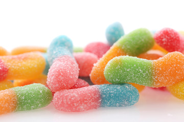 Colorful gummy jelly sugar candies close up isolated in white background