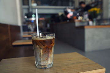Iced coffee on wood background