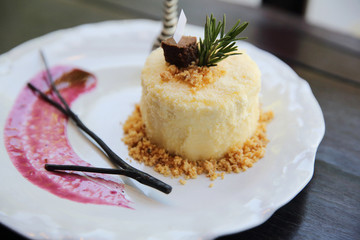 Cheese cake with blueberry jam sauce sweet food on wood background