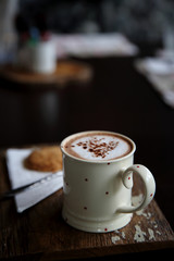 Hot chocolate on wood background