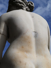 Marble statue of woman view from back 