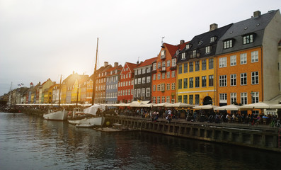 Fototapeta na wymiar Nyhavn in Copenhagen - boats and colorful facades of the houses