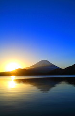 Mount Fuji of sunrise and blue sky from lake Motosu
