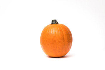Small orange pumpkin isolated on white background