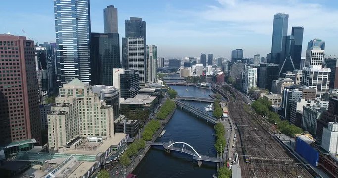 Downtown of Melbourne city along Yarra river waters between southbank and flinder station railways.
