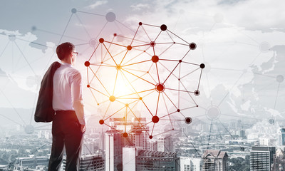 Concept of business success and control with confident boss against cityscape background