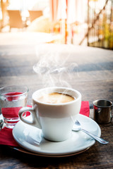 Hot coffee on wood table