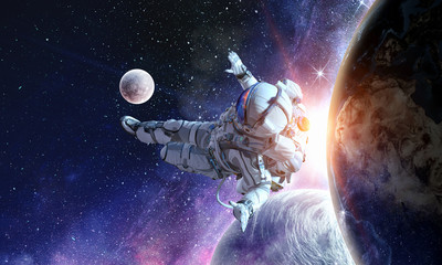 Fototapeta na wymiar Astronaut play soccer game