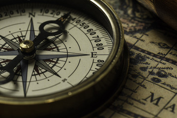 Retro compass with old map and spyglass