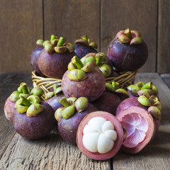 Mangosteen fruit on wood table brown with old