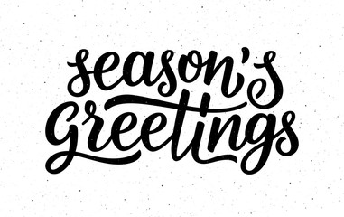 Seasons greetings calligraphy lettering text on white background with vintage paper texture. Retro greeting card for Christmas and New Year holidays. Vector background © aerial333