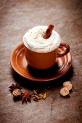 Coffee with whipped cream and cinnamon