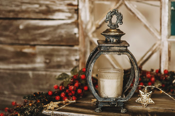 Christmas lantern with candle on the table © upparadox
