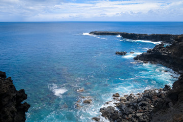 Cliffs and pacific ocean landscape vue from Ana Kakenga cave in Easter island