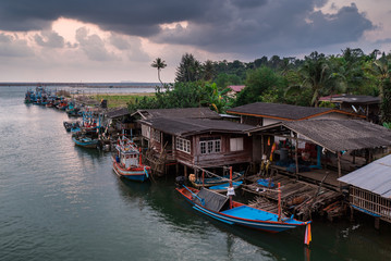 Fototapeta na wymiar View sunset of fishing village at Thailand.