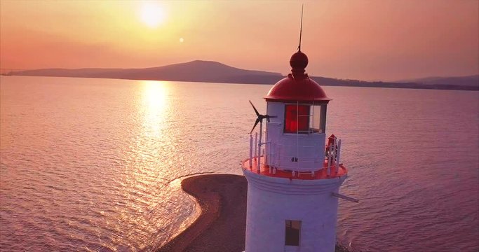 Panoramic aerial  view of old Tokarevsky lighthouse at amazing sunrise. Vladivostok, Russia.  It's a vantage attraction that shows where the land ends and the Pacific Ocean begins