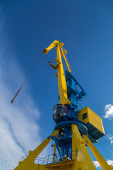 Big yellow crane and blue sky