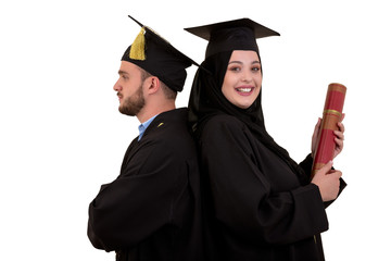 Portrait of two happy graduating arabic muslim students. Isolated over white background.