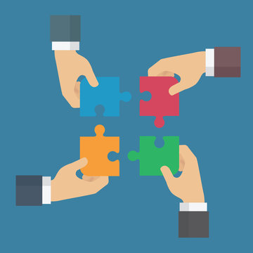 Teamwork make the dream work. Business teamwork concept. Four businessman connecting puzzle element. Symbol of working together, cooperation, partnership