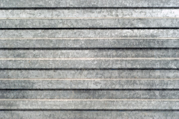 background, texture: surface area of corrugated galvanized sheet metal..