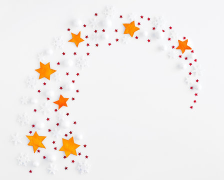 Stars and snowflakes on a white background. Christmas, winter, new year concept. Top view.