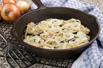 grilled onion rings in a cast iron pan