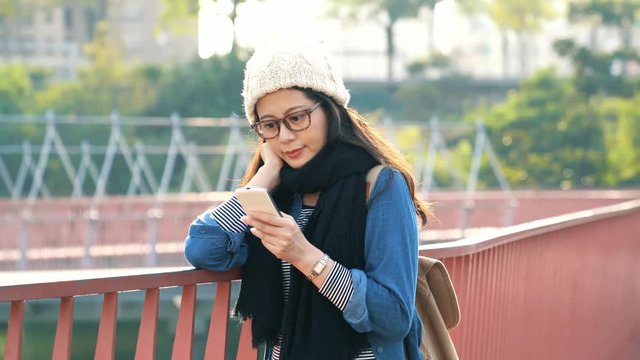 beautiful Asian girl texting message