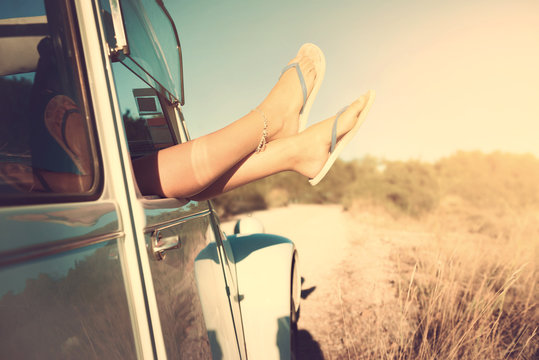 Girl's legs in a car