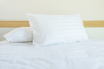 Comfortable soft pillows on the bed in hotel