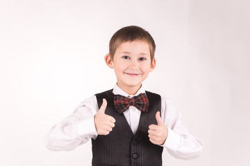 A boy posing in studio over grey background 