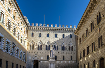 front view of Sallustio Bandini Statue in Piazza Salimbeni, Siena, Italy