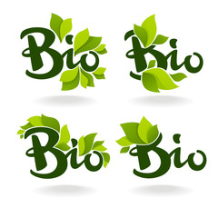 Bio labels with lettering composition and green leaves
