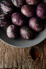 Expensive marble Easter eggs on a wooden background