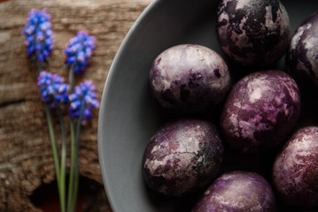 Expensive marble Easter eggs on a wooden background