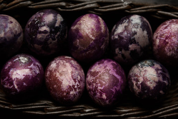 Expensive marble Easter eggs on a wooden background