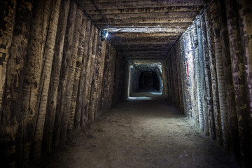 Fototapeta na wymiar Illuminated underground tunnel in old mine