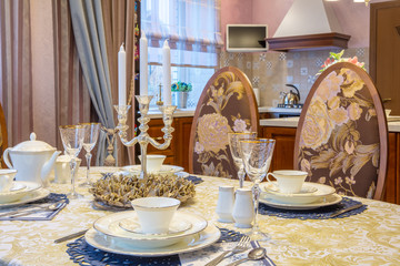 classic interior of living room. Serving table on background kitchen