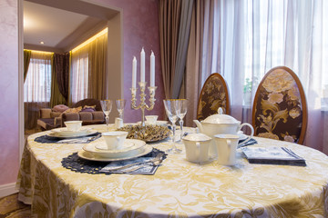 classic interior of living room. Serving table and sofa in next room