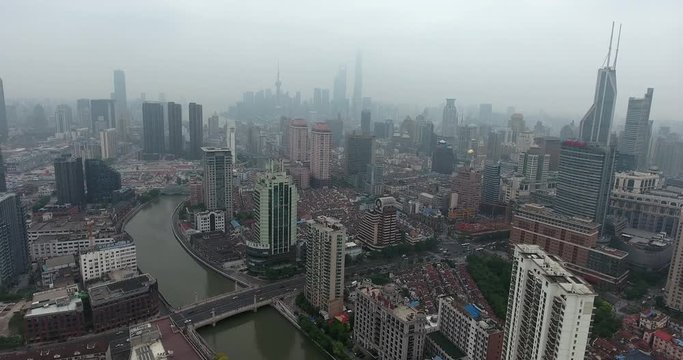 SHANGHAI, CHINA – JUNE 2016 : Aerial shot in central Shanghai with skyscrapers and Huangpu River in view