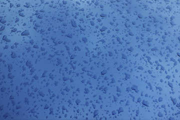 Drops on a metal surface. Abstract background.