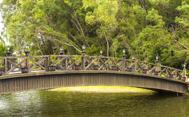 Beautiful wooden bridge across river.