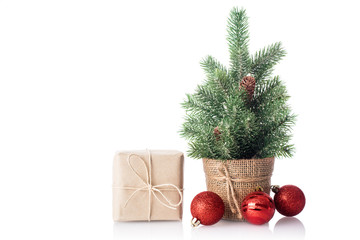 Christmas tree with gift isolated on white