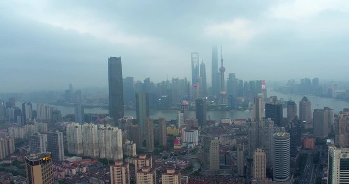 SHANGHAI, CHINA – JUNE 2016 : Aerial shot over Central Shanghai with view of Shanghai Tower, Oriental Pearl TV Tower, Jin Mao Tower and World Financial Center