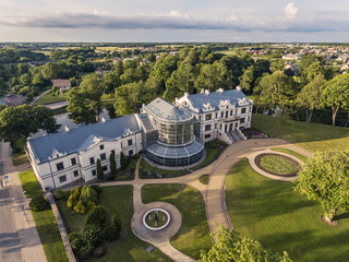 Aerial view over beautiful Kretinga museum, winter garden in Lithuania. During summer season.