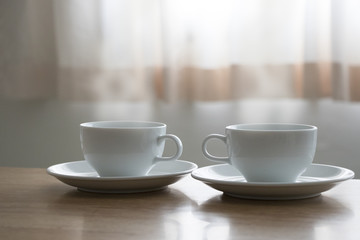 Hot coffee two cups breakfast near the curtain windows morning soft light