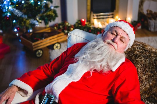 Santa Claus sleeping on couch